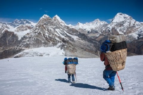 Porter Carrying Heavy Load In Nepal Himalayas, Ama Dablam