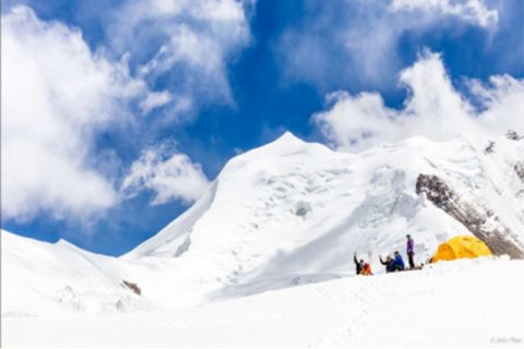 Sherpa guide fixing the camp in two, Himlung Himal Expedition