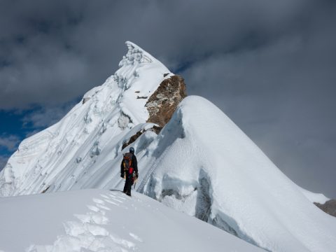 Mountaineer Standing on Snowy Ridge near the Lobuche Peak, Lobuche Peak 18 Days