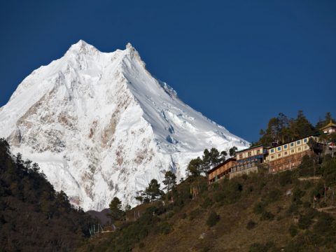 Buddhist monastery in front of Manaslu peak, Manaslu Circuit Trek 15 Days
