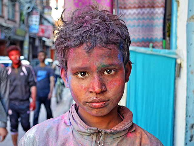 Kid Playing Holi in Nepal