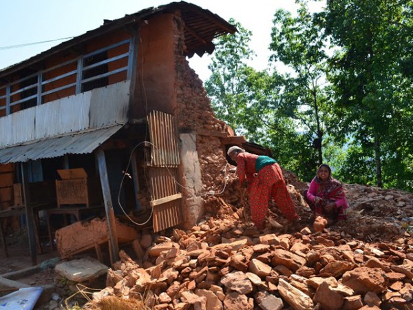 Girls Looking for Belongings in Rubble