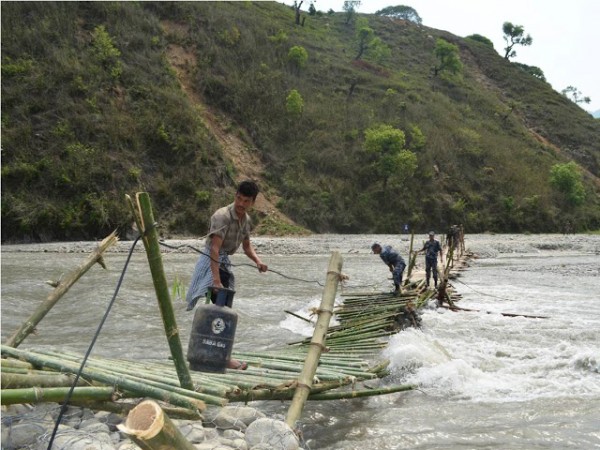 Makeshift Bridge Makes it Difficult to Carry Supplies