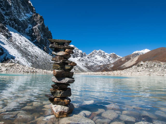Balanced stones beside a sacred lake near Gokyo