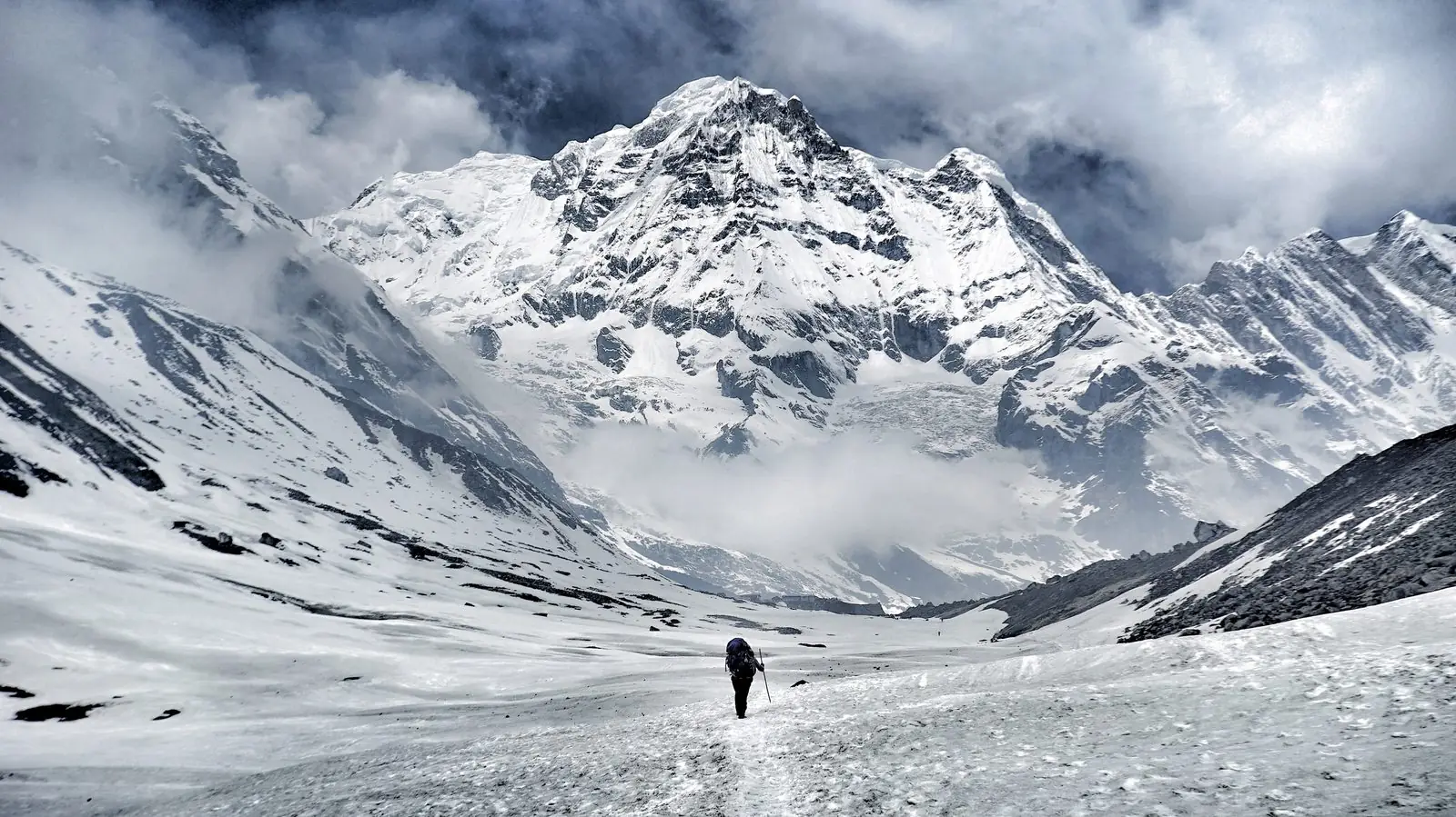A trekker walking towards Annapurna I, 8,091 m, the eighth highest mountain in Nepal